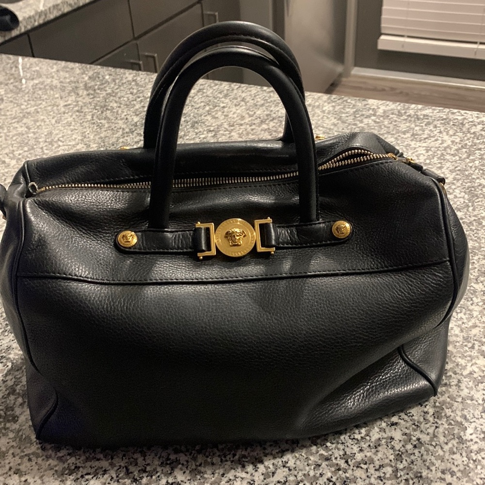 Versace bag need a good stuffing and its clean in the inside